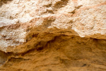 Bright yellow orange background with layers of sand and clay