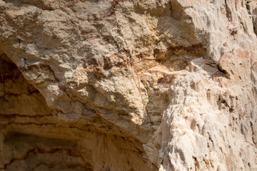 Bright yellow orange background with layers of sand and clay