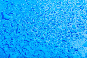 water drop on surface of fresh blue background