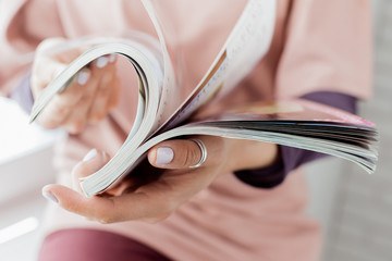 Young woman with a booklet with blank pages