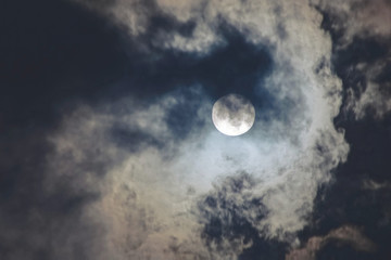 Dark cloudy sky with full moon