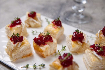 Holiday appetizers with cranberry, brie and thyme