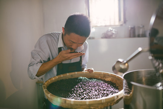 Man working at coffee roasting workshop