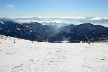 The skiers are on slope in Jasna Low Tatras, Jasna, Slovakia