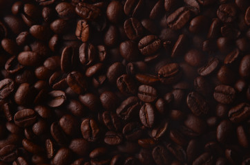 traditional brown hot coffee beans with steam smoke.