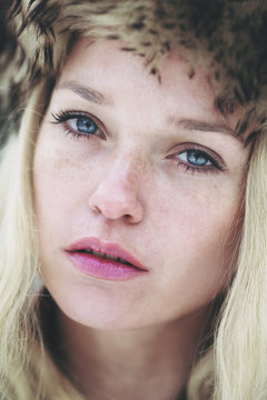 Beautiful freckled woman with blue eyes