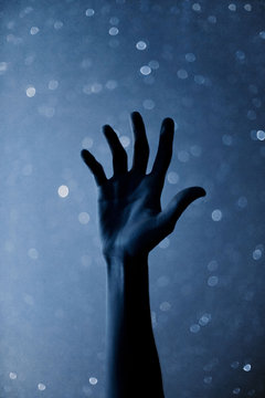 Hand Reaching Toward Stars