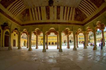 Fototapeta na wymiar Collumned hall in Sattais Katcheri in Amber Fort near Jaipur, Rajasthan, India. Amber Fort is the main tourist attraction in the Jaipur area, fish eye effect