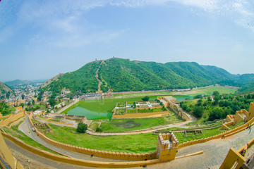 Fototapeta na wymiar Aerial view of Amber Fort near Jaipur in Rajasthan, India. Amber Fort is the main tourist attraction in the Jaipur area, fish eye effect