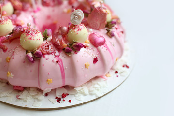 pink mousse cake for girl on white background