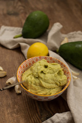 Avocado sauce in small bowl with etnic pattern 