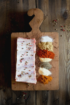 Raw pork ribs and dry rub ingredients