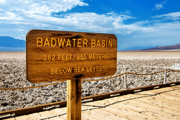 Badwater Basin sign with information about elevation at Death Valley National Park, California, USA