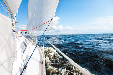 Sailing fast on port tacks with water splashing on deck