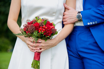 the bride is holding a bouquet of flowers