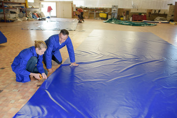 placing a big sheet on the floor