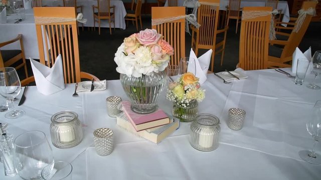 Beautifully decorated hall for wedding. Flowers and clock.