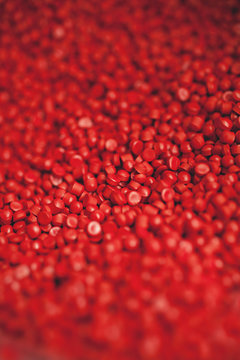 red vinyl pellets ready to melt into records