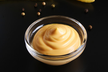 cheese sauce on a black background