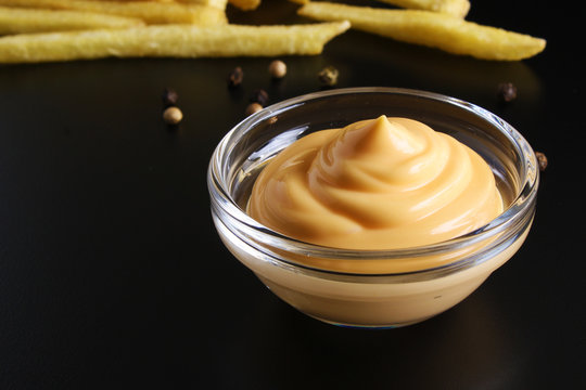 Cheese Sauce On A Black Background