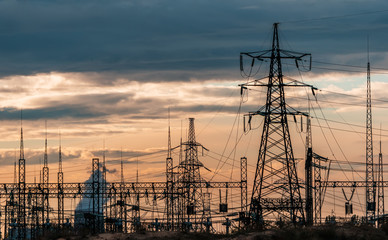 distribution electric substation with power lines and transformers.