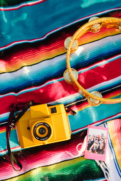 Mexican blanket with camera, tamourine