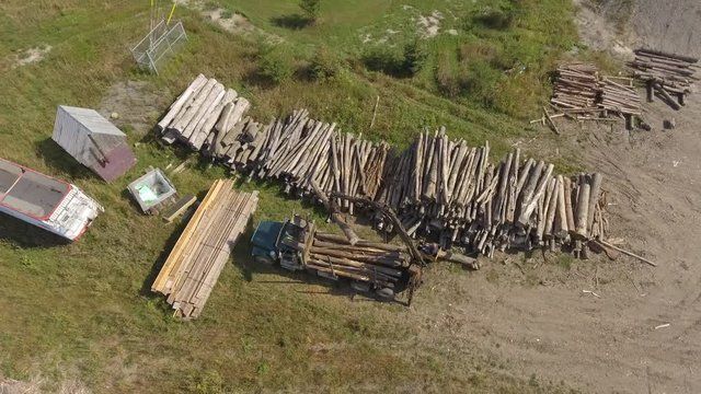 Aerial Lumber Yard Crane Moving Log Onto Truck 4k