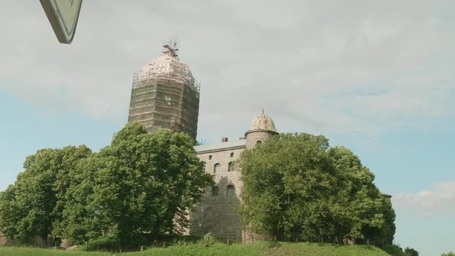 Bottom view of Viborg fortress surrounded by green trees