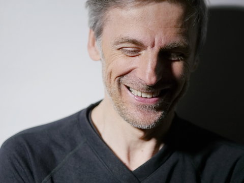 portrait middle-aged man laughing