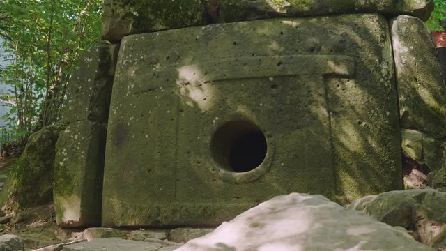 Ancient dolmen in shade of trees