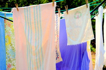 Wash day with clothes hanging outside to line dry.