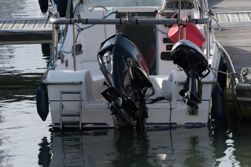 Fototapeta na wymiar Yacht stern on with two outboards