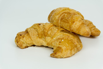 Fresh croissants isolated on white background