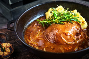 liver beef stewed in a pan with mashed potatoes