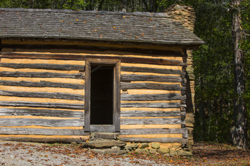 Rustic log cabin wood building structure homestead historic site texture background