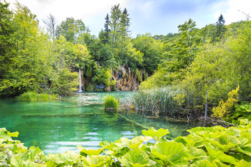 Landscape with mountains green trees and blue sky water. Plitvice lakes, Croatia