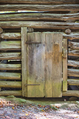 Fototapeta na wymiar Rustic log cabin wood building structure homestead historic site texture background