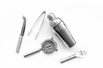 Barman equipment. Shaker, strainer on white background top view copyspace