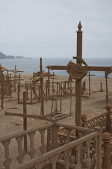 Historic cemetery from the era of nitrate mining in the Atacama Desert, at Pisagua on the coast of...