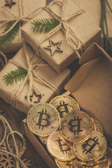 Christmas. Gifts. Bitcoins in a vintage style gift box on a wooden table