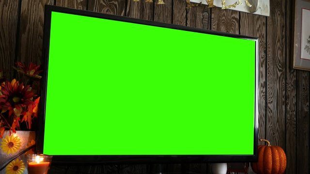 Close up of green screen HD / 4K TV in rustic fall decorated living room - ALT