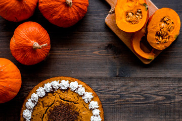 Obraz na płótnie Canvas Pumpkin pie for thanksgiving day on dark wooden background top view copyspace