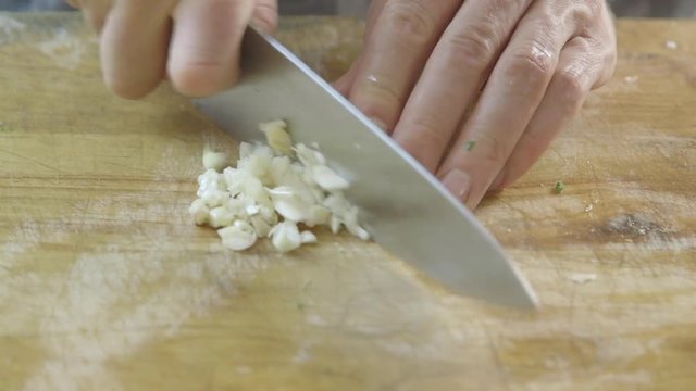 Close up: cutting garlic