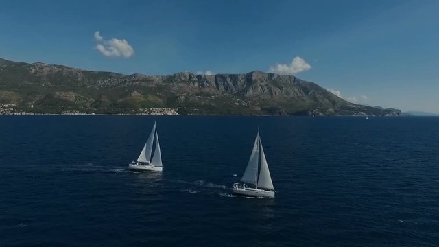 Aero shooting of two yachts in the open sea