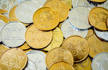 background texture close up full frame of colorful Hanukkah coins