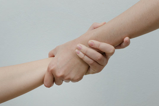 Doctor shakes hands with a patient.Helping Hands ,trust and relationship