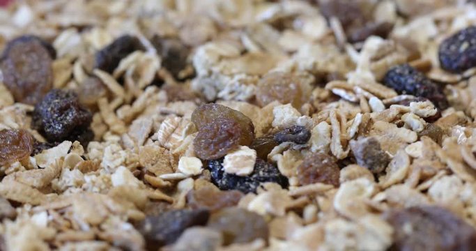 Granola texture, muesli texture,close photo image on granola or muesli pile present a detail in view of granola or muesli texture, a cereal grain healthy food, can use for background ( 4k ungraded )