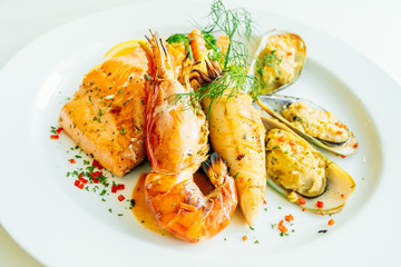 Mixed grilled seafood steak with salmon prawn and other meat