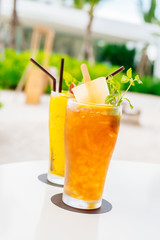 Iced cocktails drinking glass with beach and sea