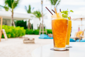 Iced cocktails drinking glass with beach and sea
